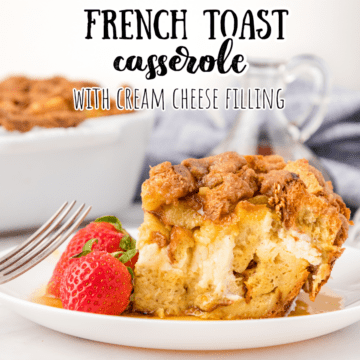 one piece of french toast casserole on a plate with strawberries