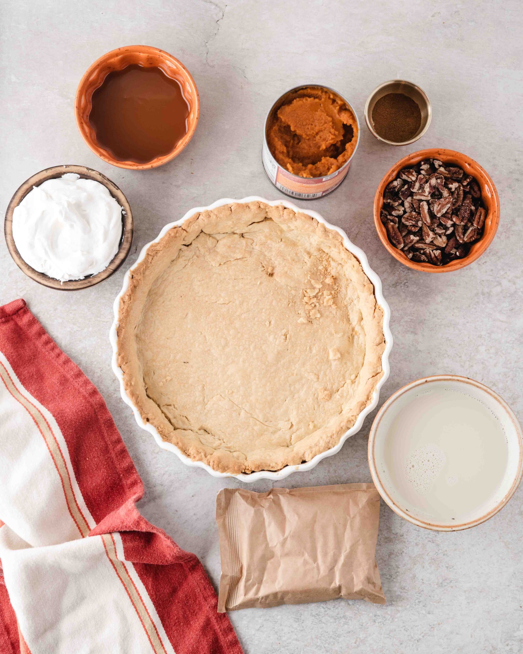 Pictured is all the ingredients to make a no-bake pumpkin pie