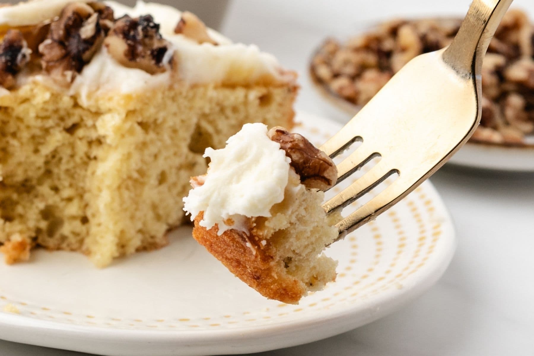 Homemade banana cake topped with creamy frosting