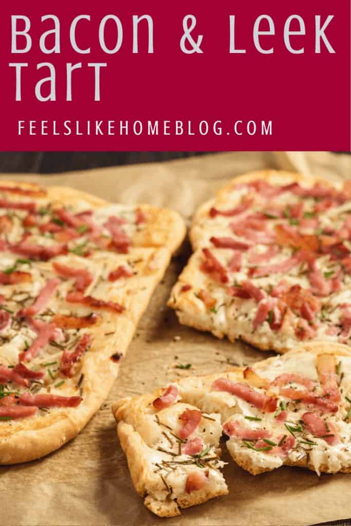 A slice of pizza on a cutting board, with leek and Bacon