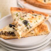 Cheesy white pizza slices