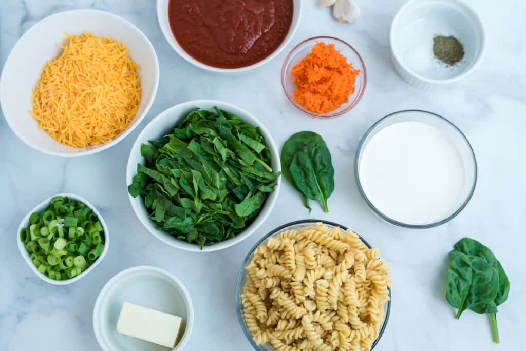 Creamy pasta with spinach and red sauce ingredients