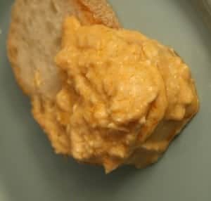 Buffalo chicken dip on a piece of bread