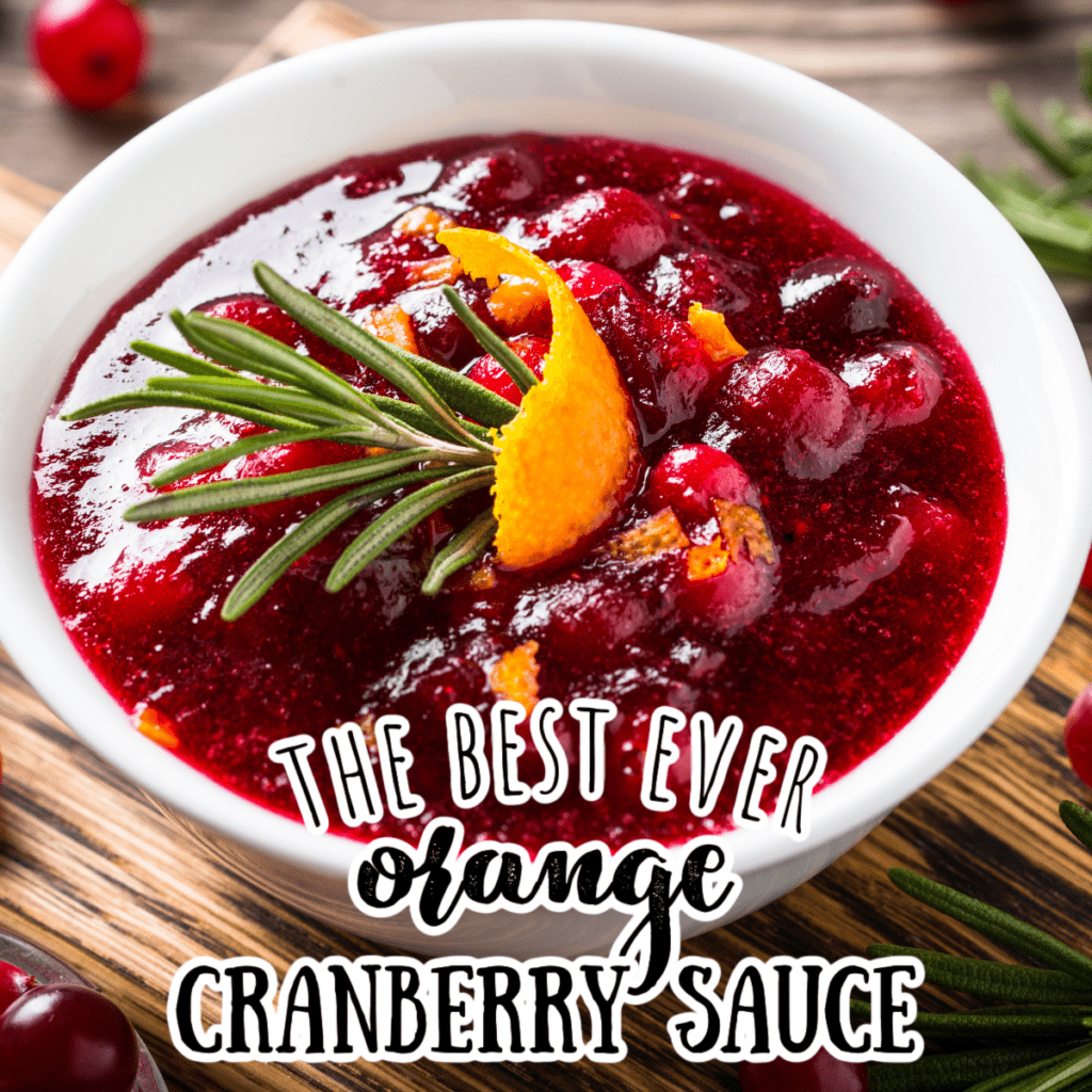 a white bowl filled with cranberry sauce and an orange rind on top