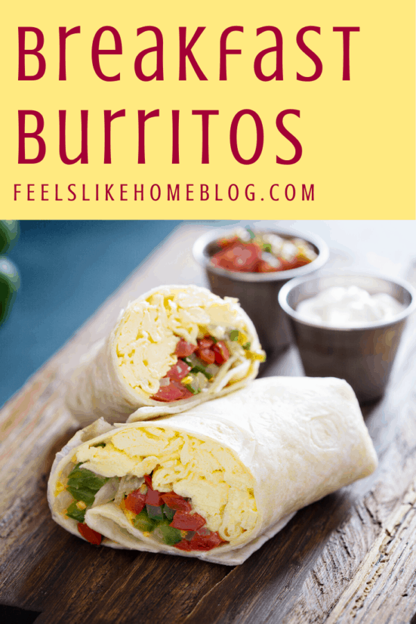 A breakfast burrito sitting on top of a wooden table