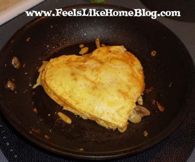 The second skillet with the first egg heart