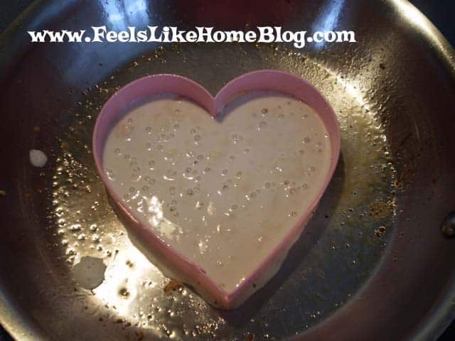 A heart shaped cookie cutter with Pancake and chocolate chips