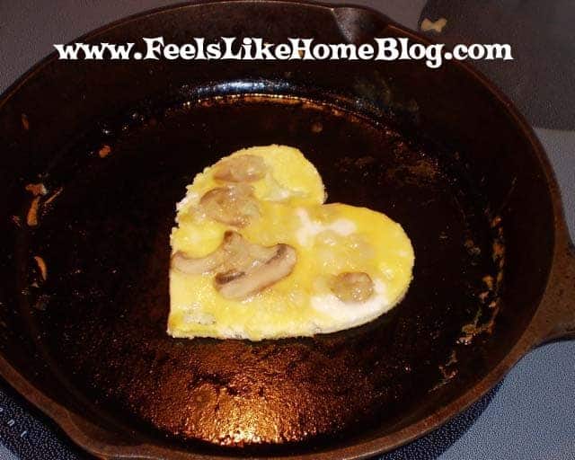 The heart omelet with mushrooms and onions