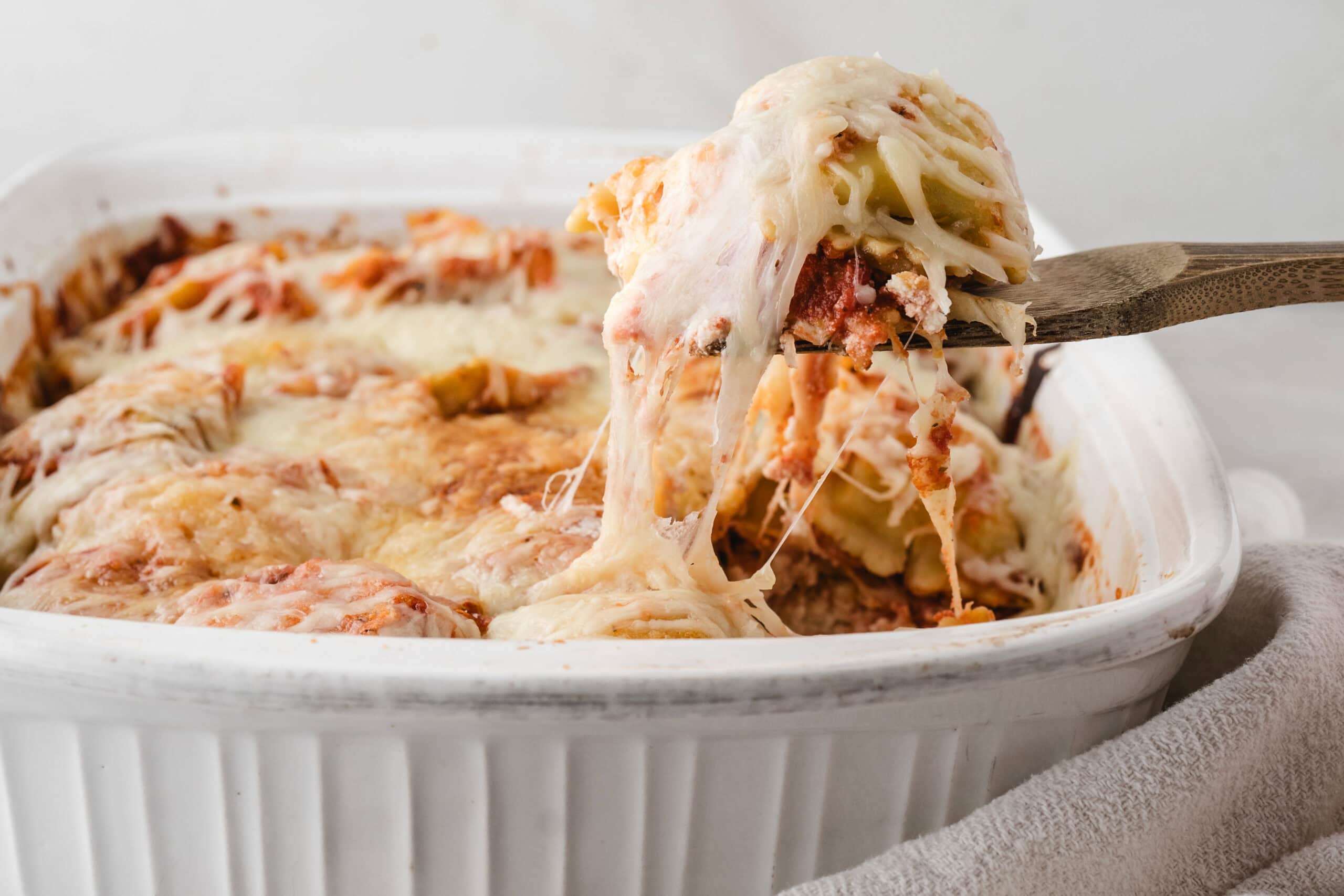 Baked Ravioli cooled and scooped up, ready to be put on a plate