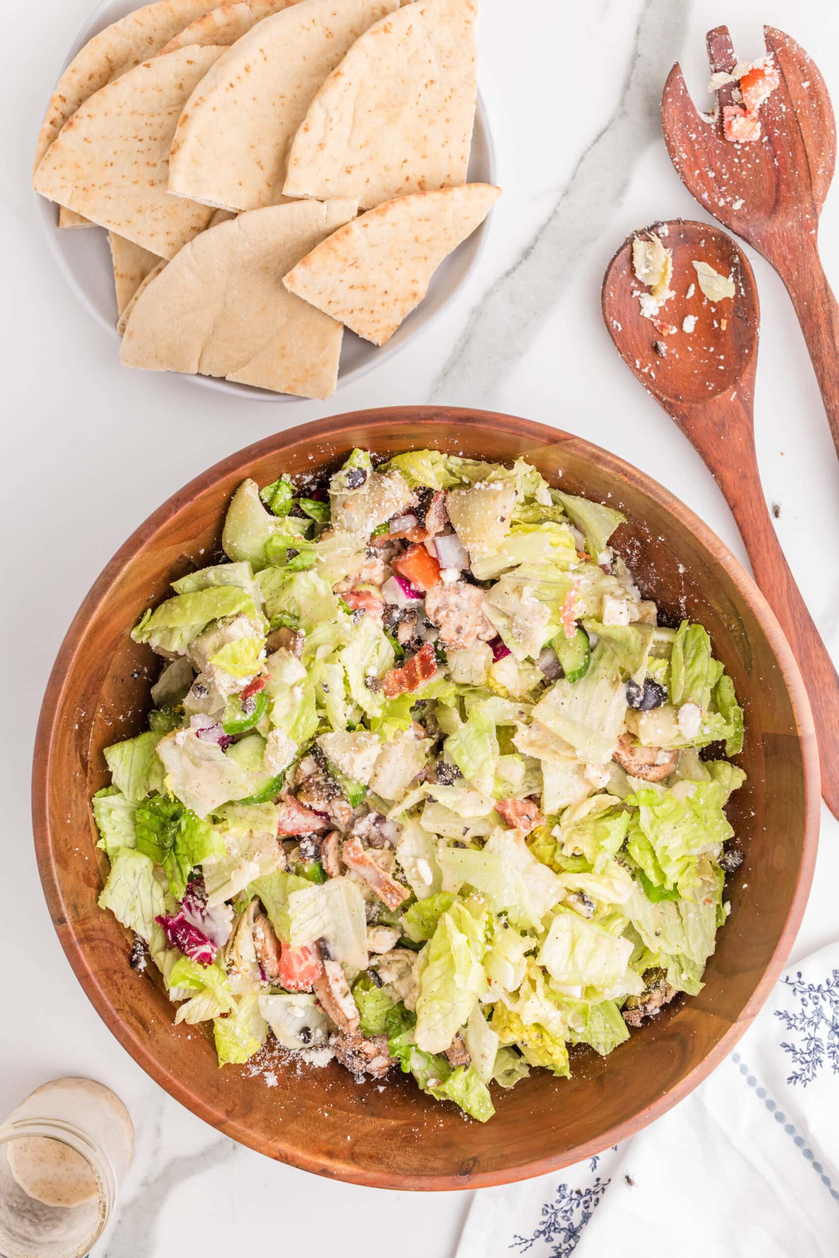 Homemade Greek salad with lettuce and pita bread