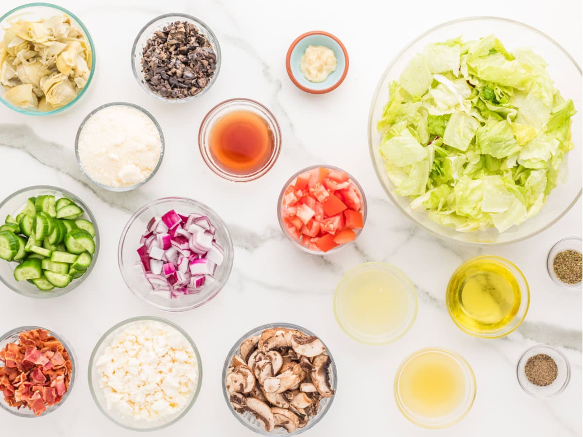 Fresh ingredients for homemade Greek salad with dressing