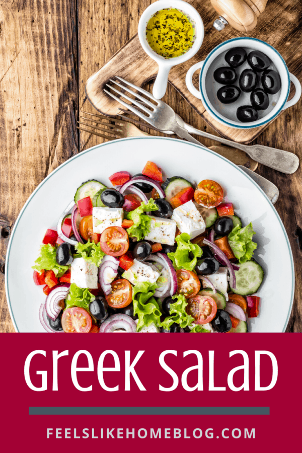 A plate of food on a table, with Salad and Cucumber and feta