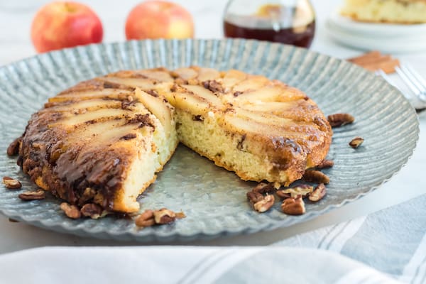 a baked apple pecan pancake with one slice out