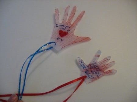 A close up of shrinky dink hands