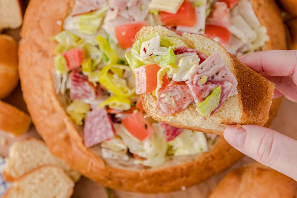 a close up of Italian hoagie dip on a slice of toasted bread