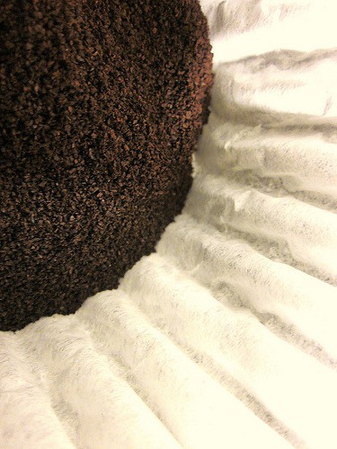 a coffee filter with coffee grounds in the center