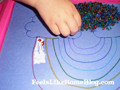 Picking rice out of a bag to attach to the rainbow