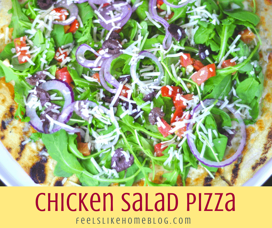 chicken salad pizza with tomato, onion, lettuce, and cheese