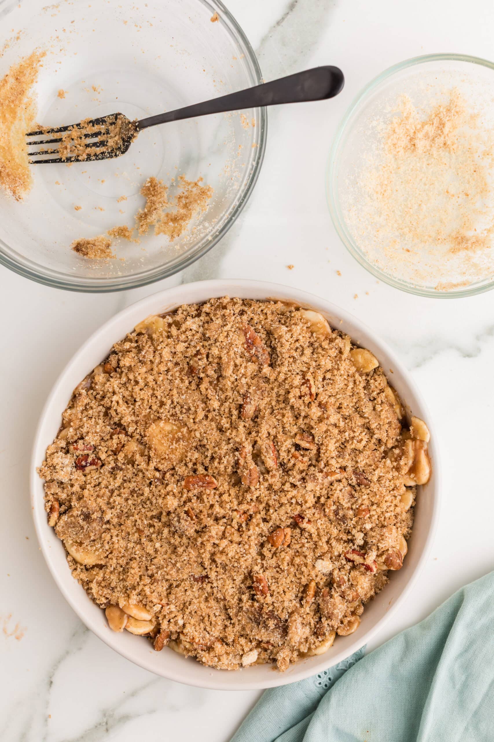 Unbaked banana cobbler with brown sugar pecan topping