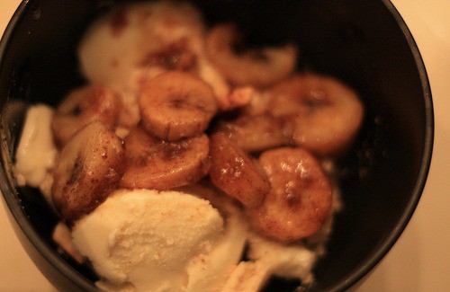 A close up of bananas and ice cream