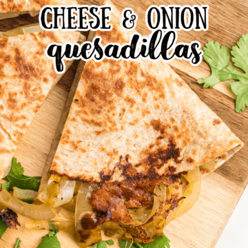 one wedge of a cheese and onion quesadilla on a wooden cutting board