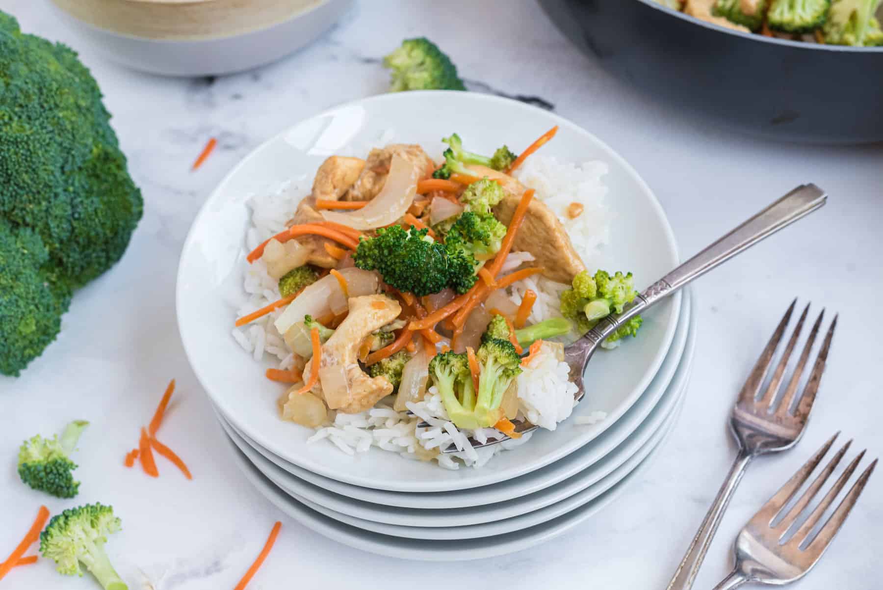 garlic chicken stir fry on a white plate