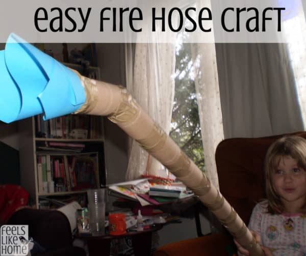 A girl with a pretend fire hose