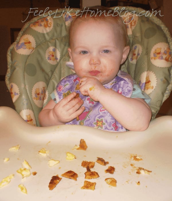 A baby sitting in a high chair