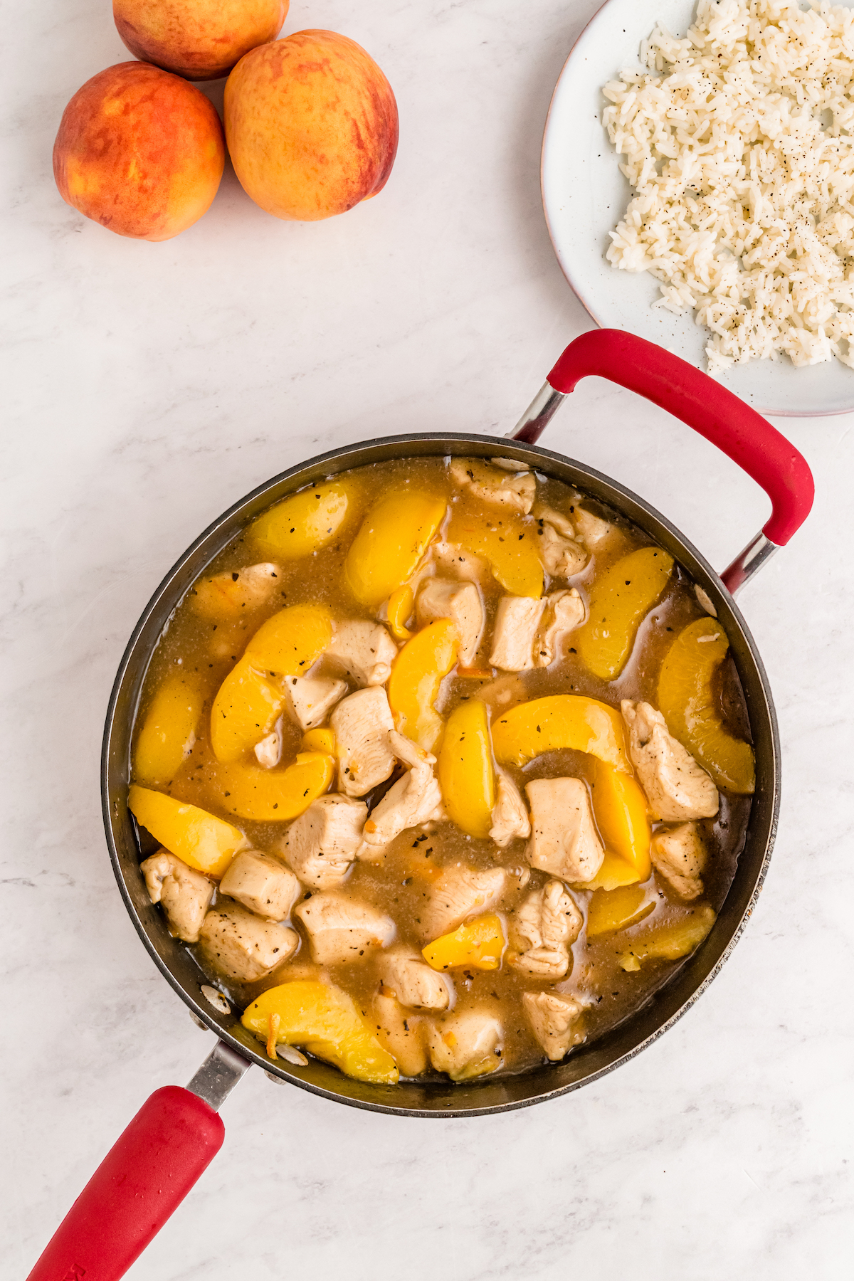 add peaches to the chicken in the skillet