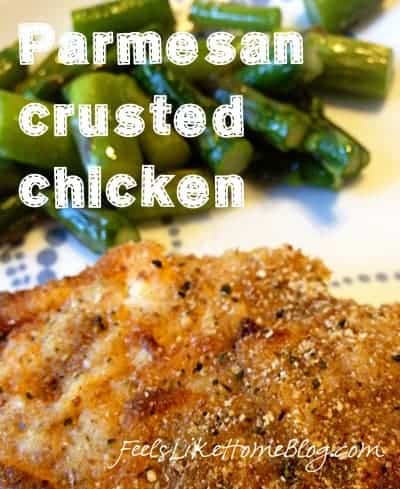 a piece of chicken breaded with Parmesan cheese and asparagus and the title \"Parmesan crusted chicken\"