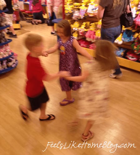 A group of kids dancing at Build A Bear Workshop