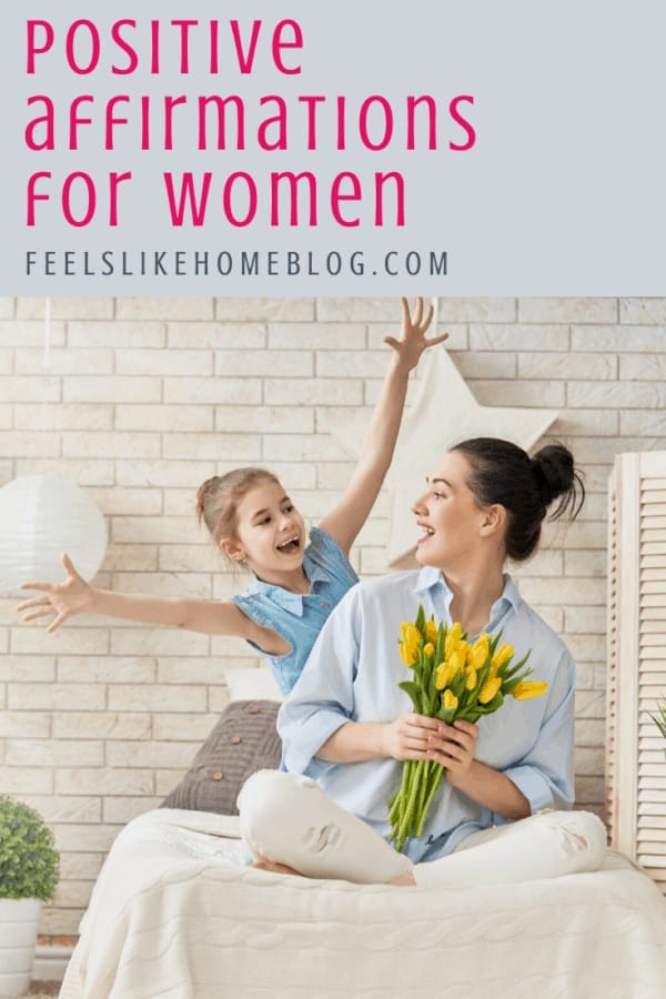 A woman smiling at her daughter