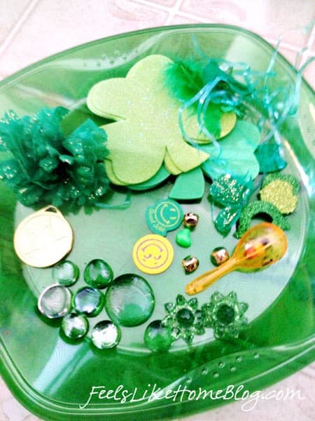 A close up of a green plate, with small objects