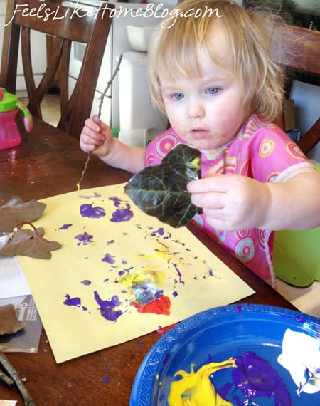 A little girl looking excited to paint