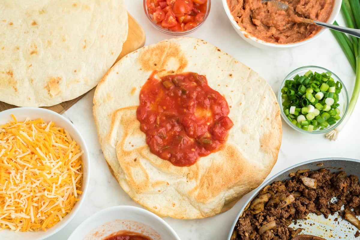 top the second tortilla with salsa