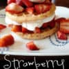 A cake with fruit on a plate, with Strawberry and Waffle