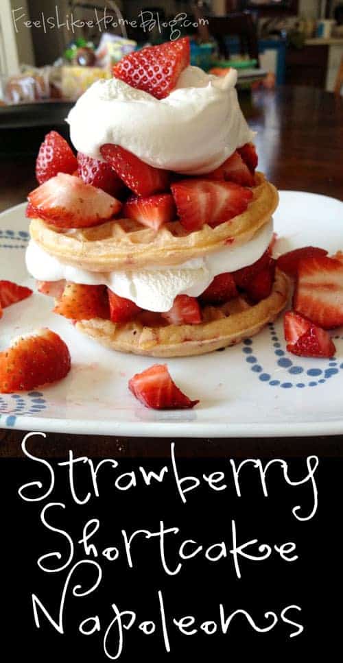 A cake with fruit on a plate, with Strawberry and Waffle