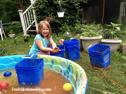 A little girl with mud pies