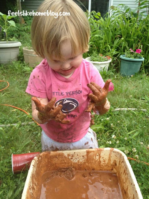A little girl covered in mud