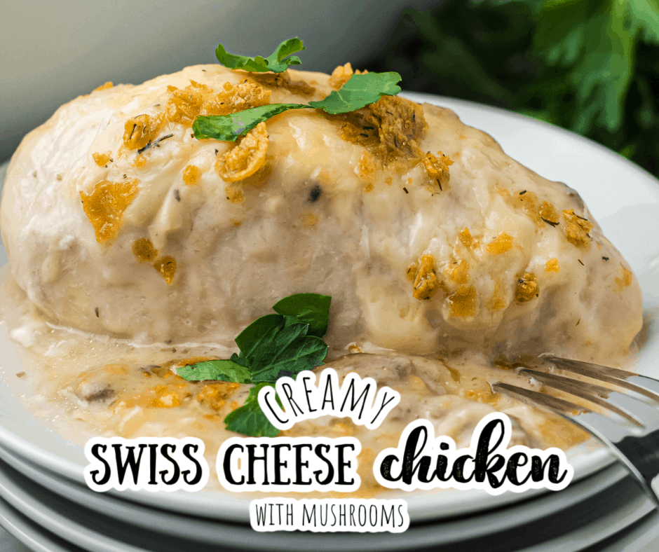 creamy swiss cheese chicken on a plate with a fork