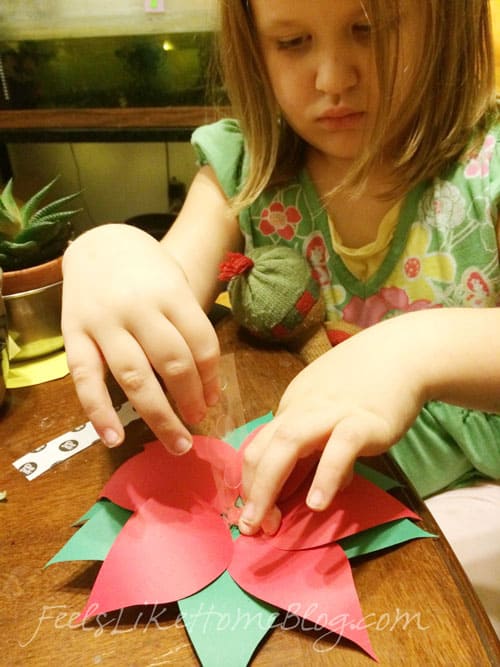 A little girl sitting at a table