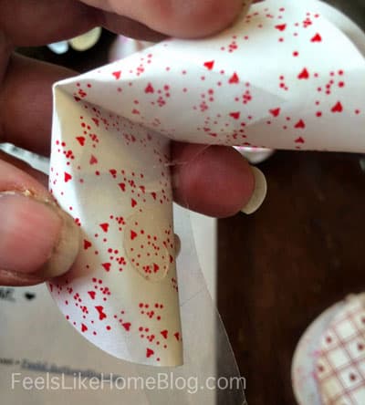 Attach a glue dot to the inside of the cookie