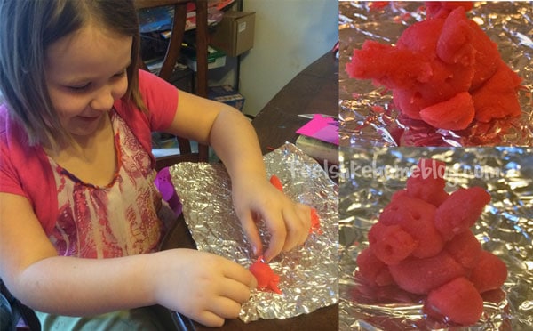 a little girl making a marzipan piggy
