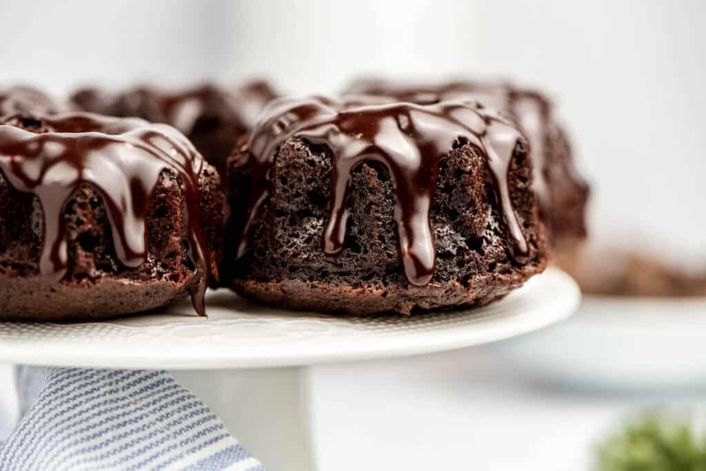 chocolate fudge bundt cakes drizzled with homemade milk chocolate ganache