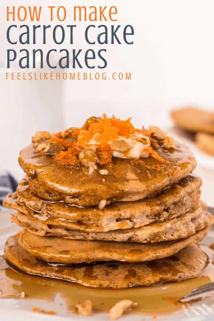 A stack of carrot cake pancakes with grated carrots and walnuts and syrup