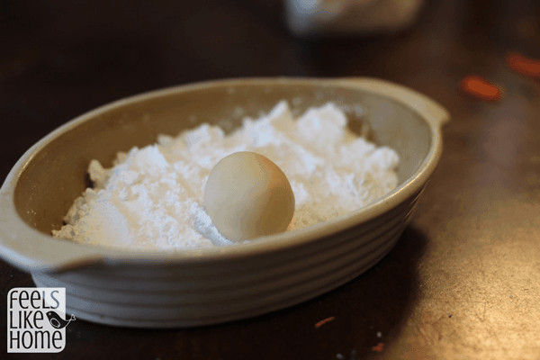 Roll the balls in powdered sugar