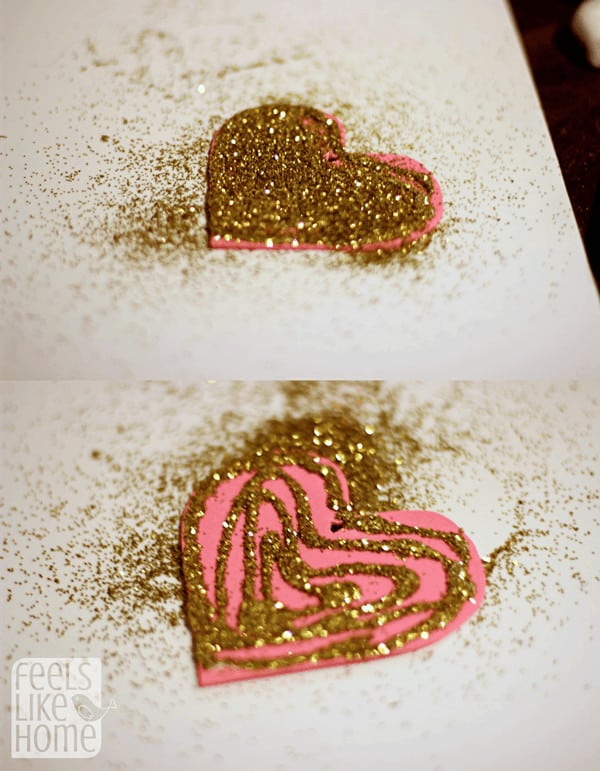 Put glue and glitter on the hearts