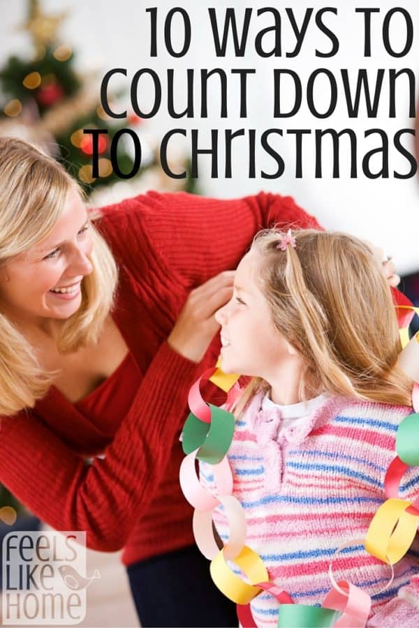 A woman and her daughter looking at a paper chain