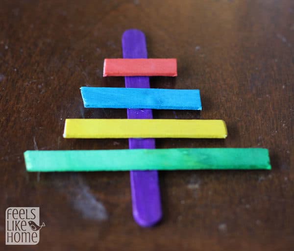 a multi-colored popsicle stick Christmas tree