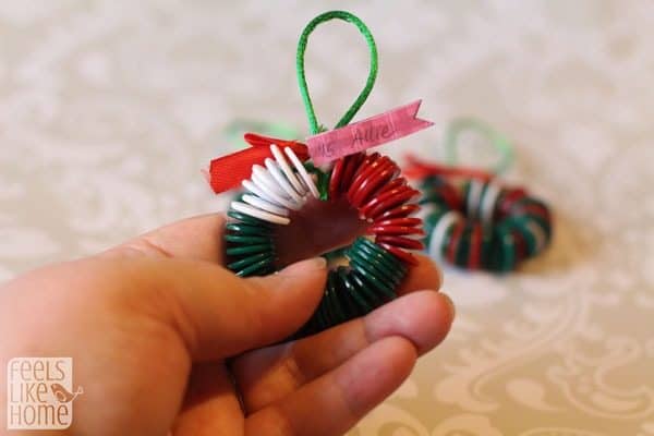 a wreath craft made from green, white, and red buttons